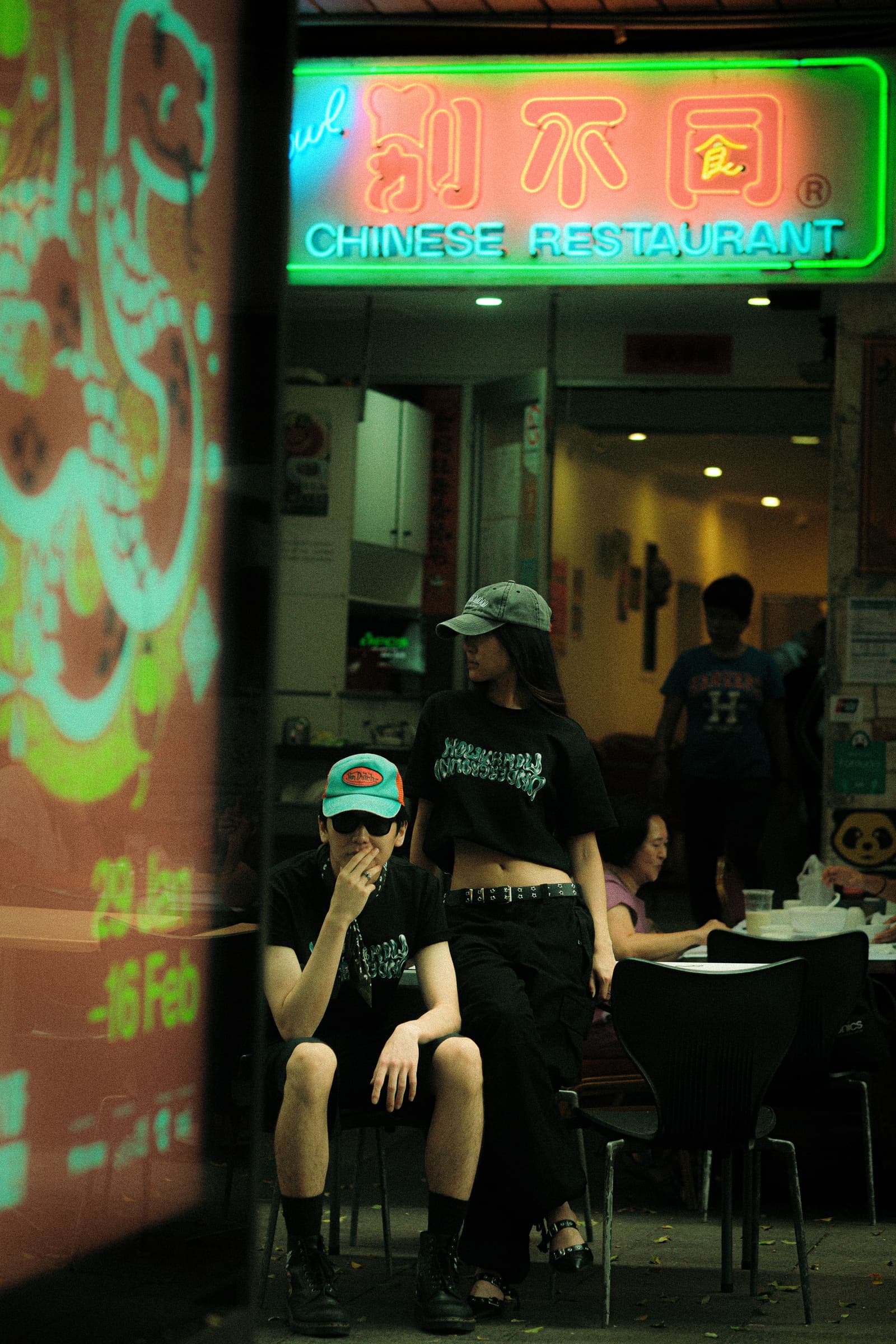 A closer take under the restaurant's neon