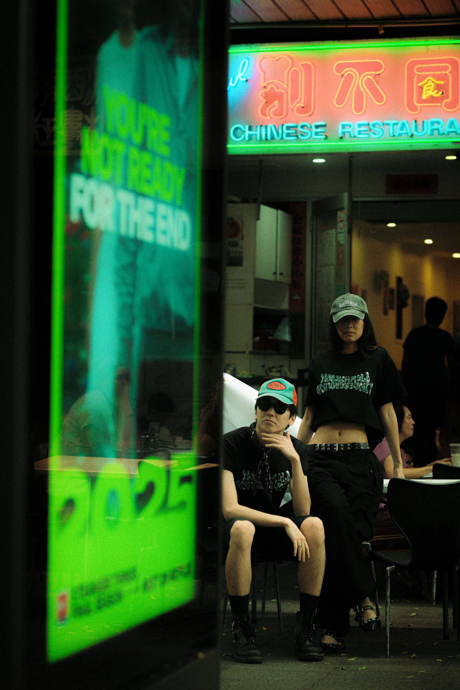 The same scene through a green poster in the foreground