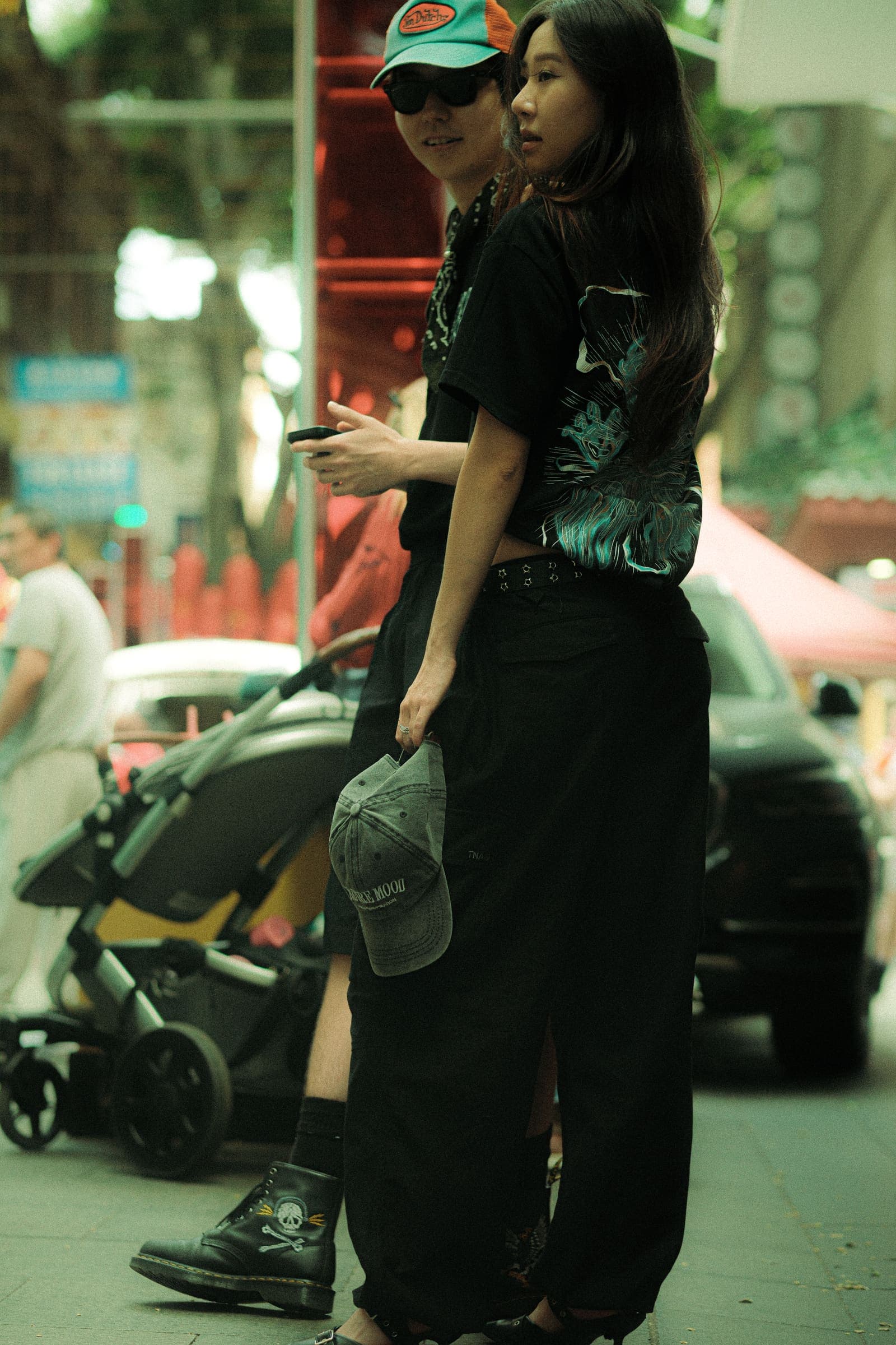 Two models pausing on the street